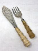 A fine pair of Victorian silver and ivory fish servers, Harrison & Howson, Sheffield 1880,