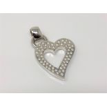 A heavy white gold heart pendant set with 57 diamonds, approx. 2.