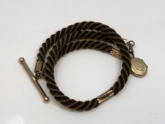 An antique hair Albert chain with gold T-bar, dog-catch and fittings.