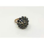 A 14ct gold sapphire cluster ring (one stone deficient),