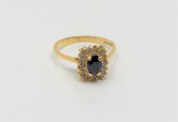 An 18ct gold sapphire and diamond ring, size O/P.