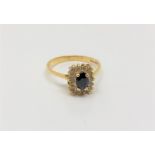 An 18ct gold sapphire and diamond ring, size O/P.