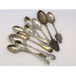 A collection of silver rifle and regimental spoons
