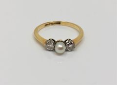 An 18ct gold pearl and diamond ring, size P. CONDITION REPORT: 2.4g.