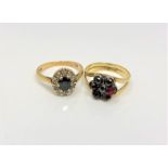 An 18ct gold sapphire and diamond ring and a gold garnet ring (2)