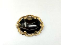 An antique gold and agate brooch