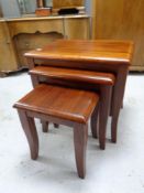 A nest of three eastern hardwood tables