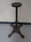 A cast iron pub table pedestal