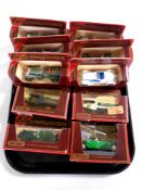 A tray containing ten Matchbox Models of Yesteryear die cast delivery vehicles and classic cars,