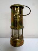 A Lamp and Limelight brass miner's lamp