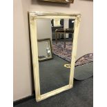 A cream traditional style mirror,