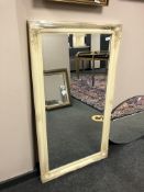 A cream traditional style mirror,