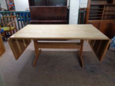 A continental oak refectory flap sided dining table