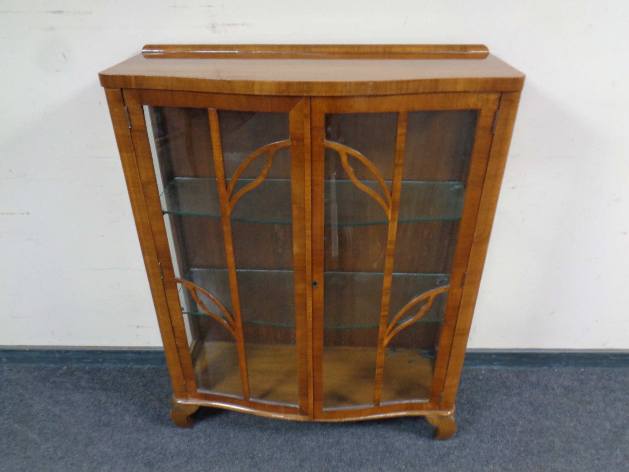 A 20th century walnut double door display cabinet,