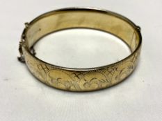 A vintage silver engraved bangle