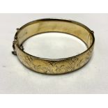 A vintage silver engraved bangle