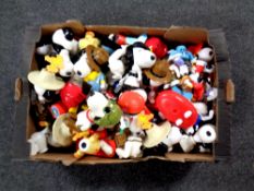 A box containing a large quantity of plastic Snoopy figures