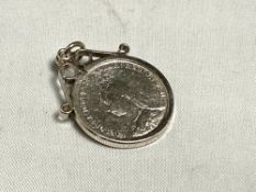 An 1888 silver four pence piece in mount