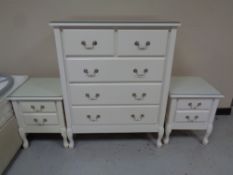 A contemporary five drawer chest together with a pair of matching two drawer chests (white)