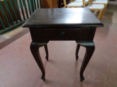 An eastern hardwood occasional table fitted a drawer
