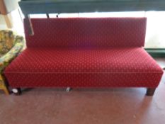 A 20th century day bed upholstered in a red fabric