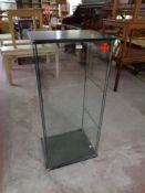 A square glass display cabinet together with a triple dressing table mirror