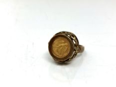 A 9ct gold ring inset with 1945 Dos Pesos coin CONDITION REPORT: 6.