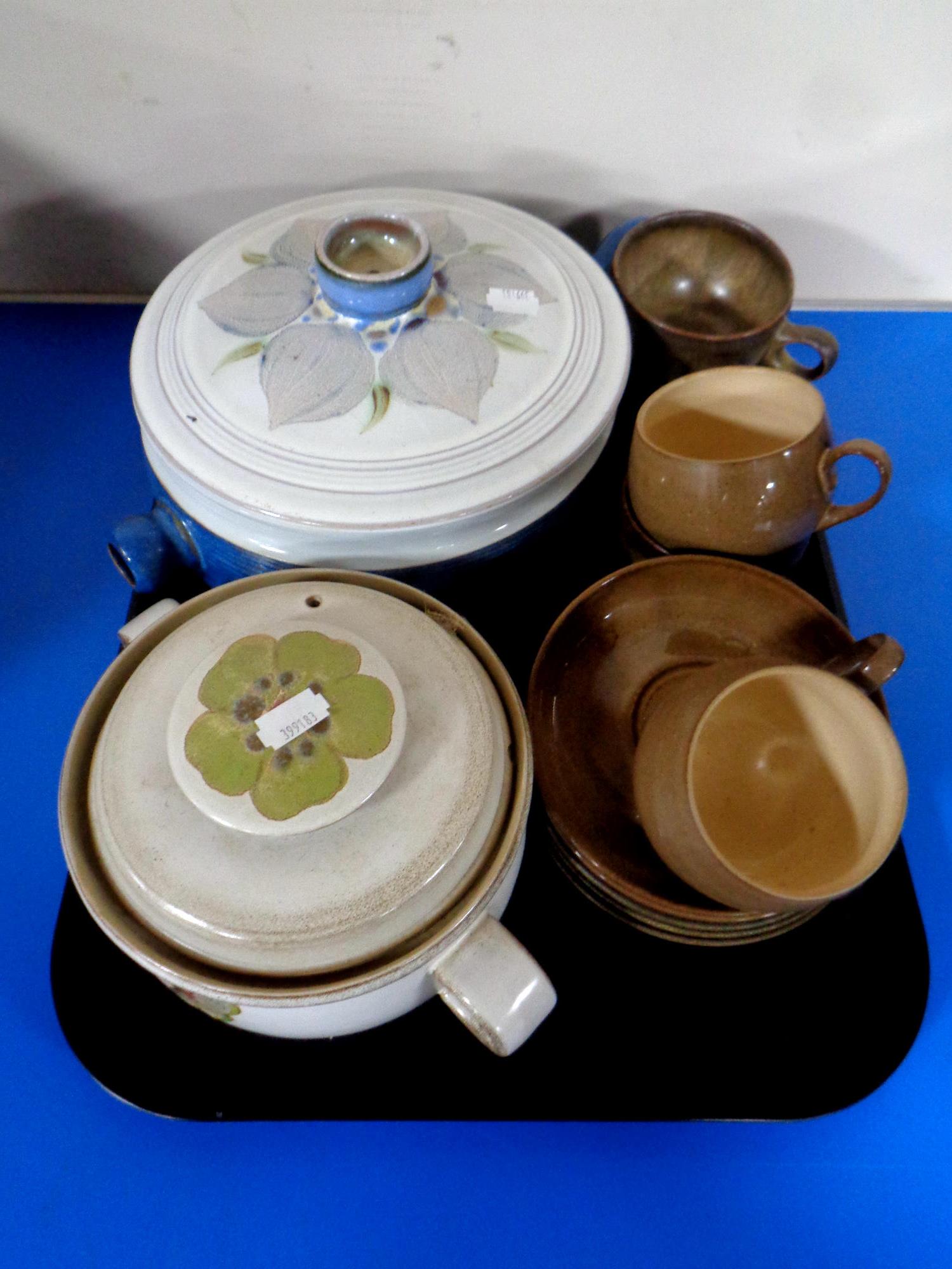 A tray containing two Denby lidded cooking pots together with five Denby cups and saucers