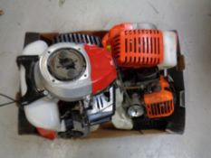 A box containing five petrol brush cutter engines