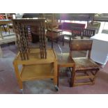 An oak studded leather upholstered dining chair together with a two tier tea trolley,