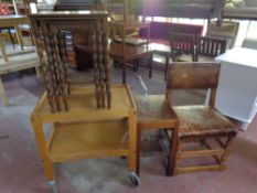 An oak studded leather upholstered dining chair together with a two tier tea trolley,