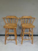 A pair of pine breakfast bar chairs