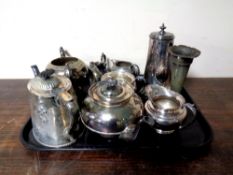 A tray containing antique plated wares to include tea ware and a fluted vase