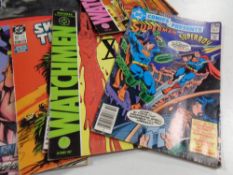 A crate containing DC comics to include Watchmen, Superman, Teenage Mutant Ninja Turtles calendar,