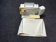 A Riccar 440 electric sewing machine with cover