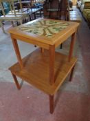 A 20th century Danish teak coffee table together with further tile topped lamp table