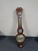 A banjo barometer with silvered dial