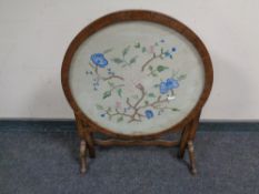 A 20th century needlework fire screen/occasional table