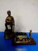 A large brass figure of a miner together with a further brass figure of a miner with a coal tub,