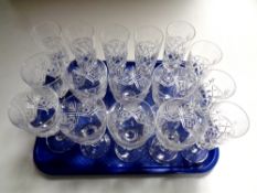 A tray containing a set of eight Brierley lead crystal champagne flutes together with a further set