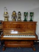 A walnut cased overstrung upright piano