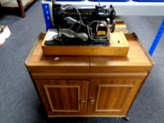 A 20th century Willcox and Gibbs electric sewing machine together with a hostess trolley