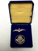 A 9ct gold RAF brooch and a silver brooch