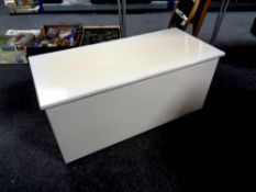 A painted plywood blanket box together with a dralon upholstered footstool