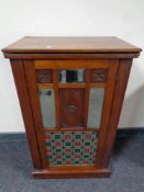 An Edwardian mahogany music cabinet