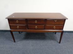 A Stag Minstrel six drawer chest on raised legs (as found)