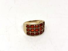A 9ct gold dress ring set with red stones, size N CONDITION REPORT: 4.