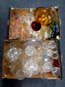 Two boxes containing a large quantity of assorted glassware to include drinking glasses, vases,