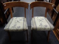 A pair of antique continental oak shaped back chairs