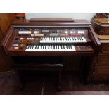 A Technics electric organ with stool (continental wiring)